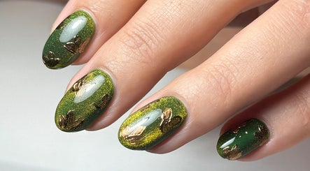 Stunning green nails with golden leaf design at Sarah Emily Nails, Horsforth, England, GB.