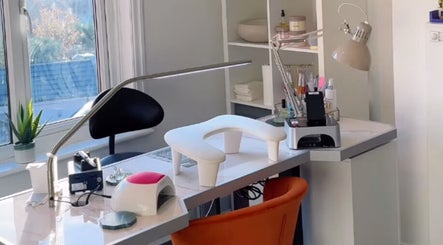 Bright, modern nail station at Sarah Emily Nails, Horsforth, England, GB, featuring cozy seating and tools.