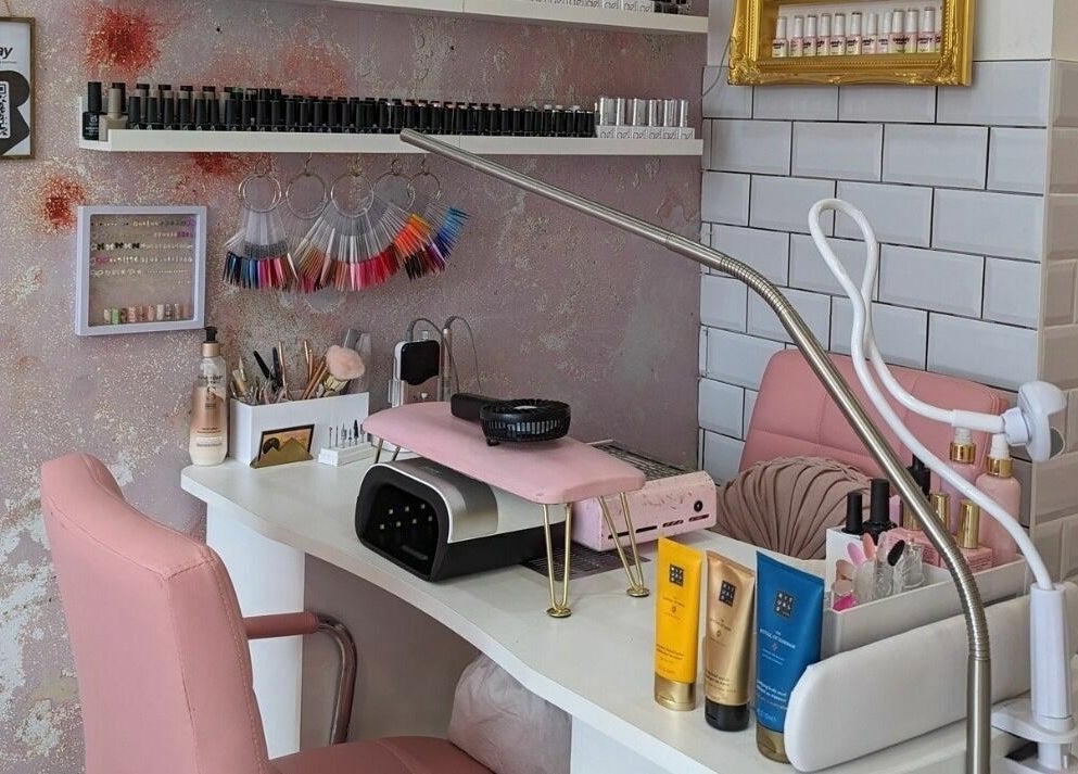 Elegant nail salon station at On Point SE19 in London, England, GB, showcasing tools and beauty products.
