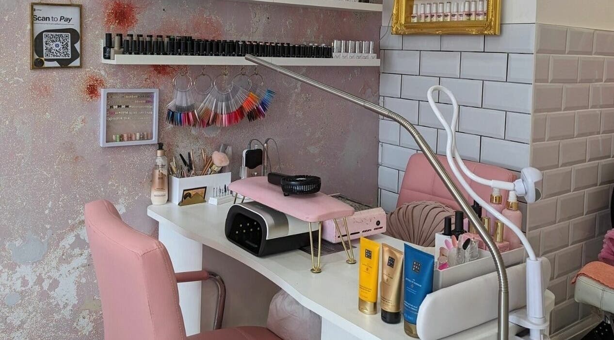 Elegant nail salon station at On Point SE19 in London, England, GB, showcasing tools and beauty products.