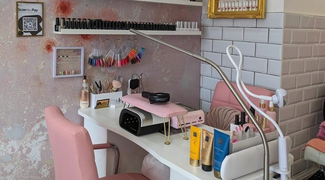 Elegant nail salon station at On Point SE19 in London, England, GB, showcasing tools and beauty products.