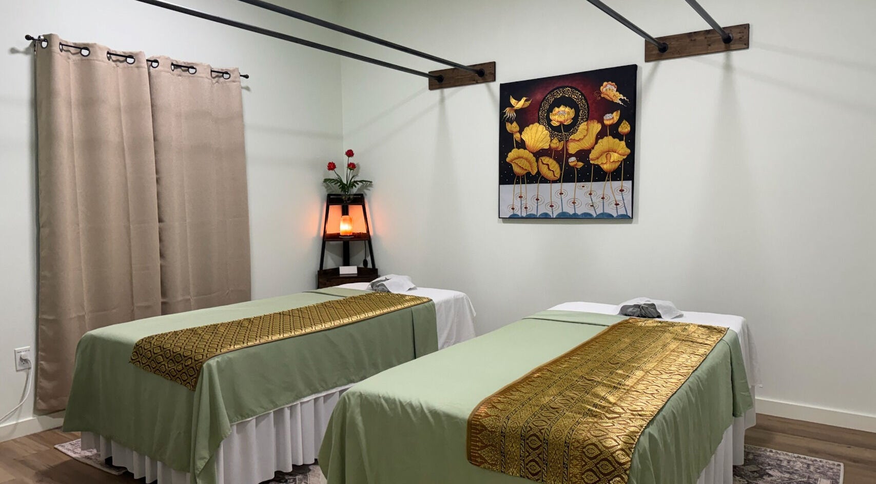 Relaxing treatment room at Nam Massage & Day Spa, Southlake, Texas with dual massage tables and serene decor.