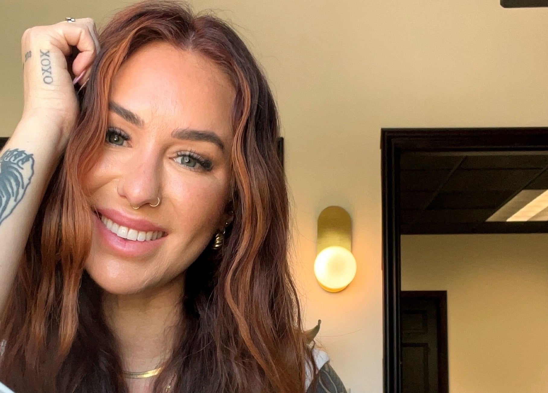 A person smiling warmly inside Britt Babe Cave in Temecula, California, US.