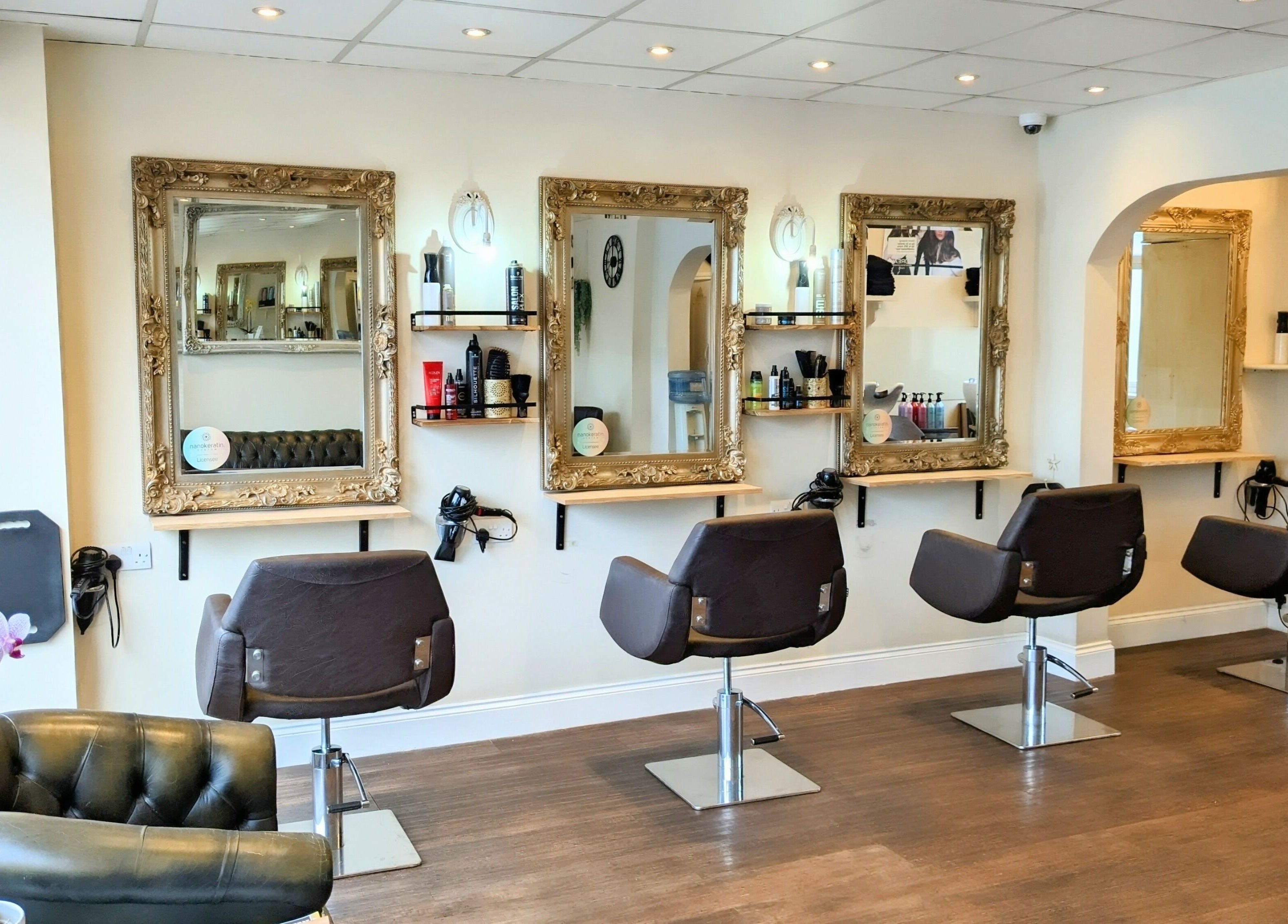 Stylish interior of No.77 Hair Salon Coulsdon with elegant chairs and mirrors in Coulsdon, England, GB.