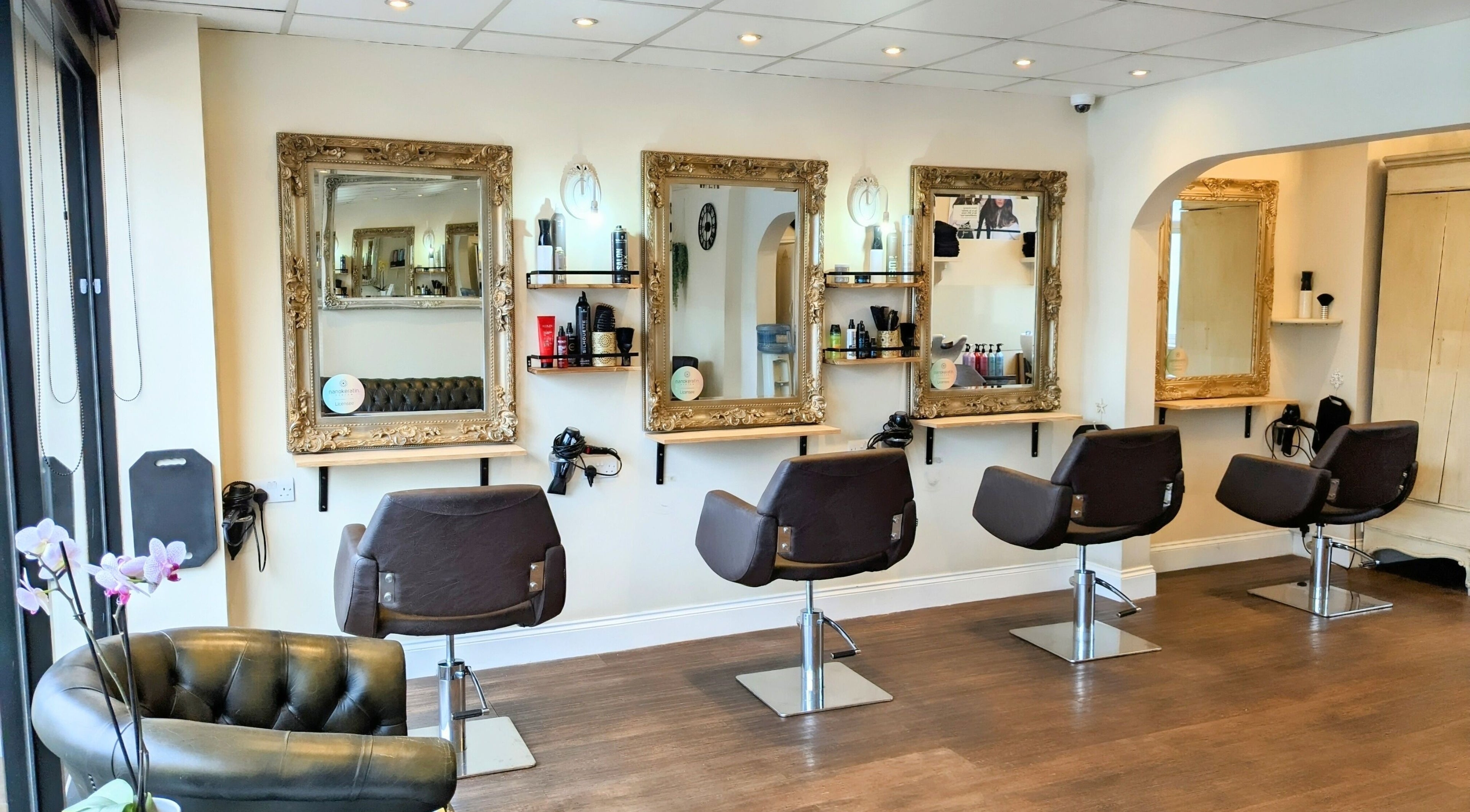 Stylish interior of No.77 Hair Salon Coulsdon with elegant chairs and mirrors in Coulsdon, England, GB.