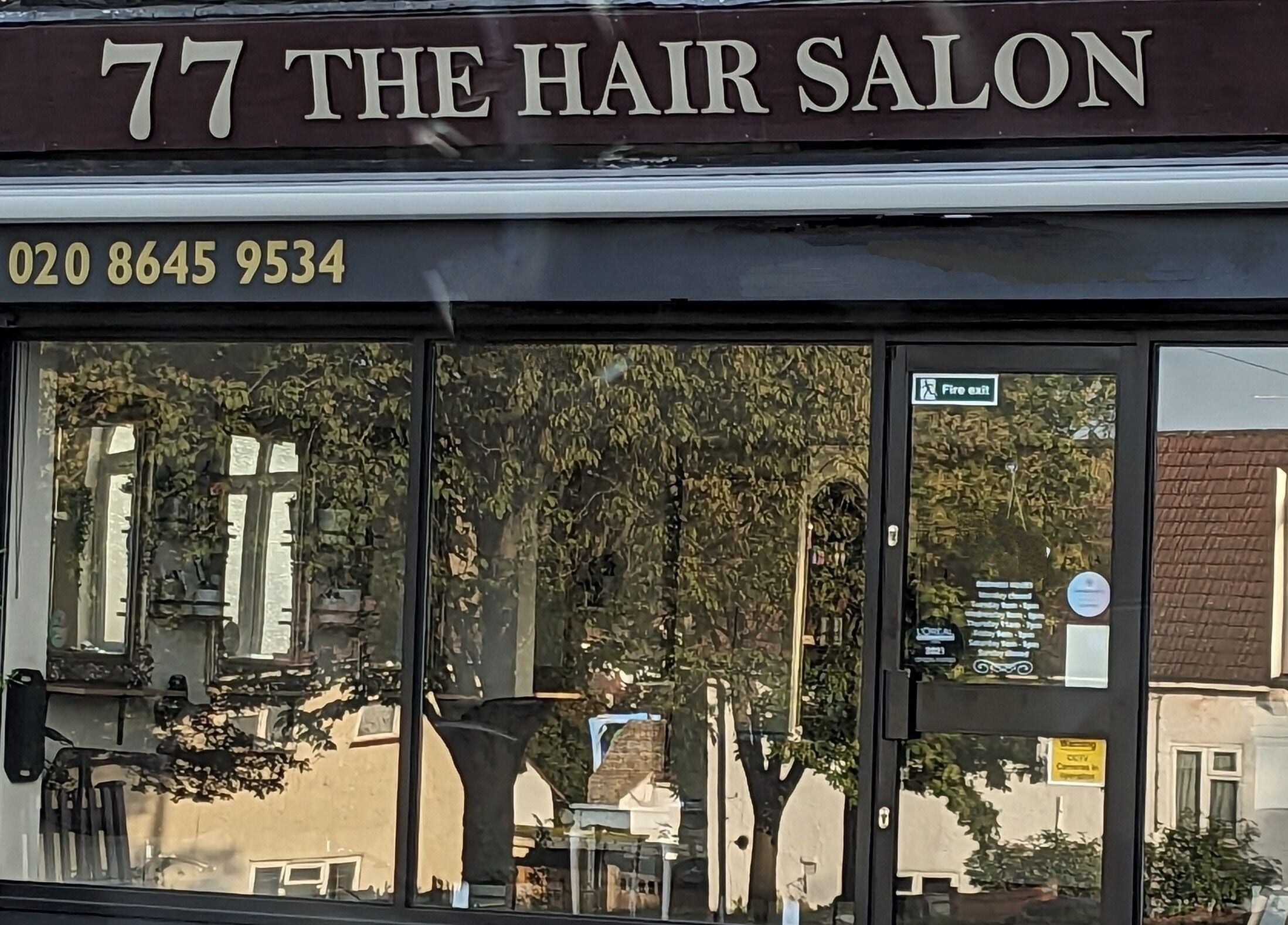 No.77 Hair Salon Coulsdon storefront with signage in Coulsdon, England, GB.