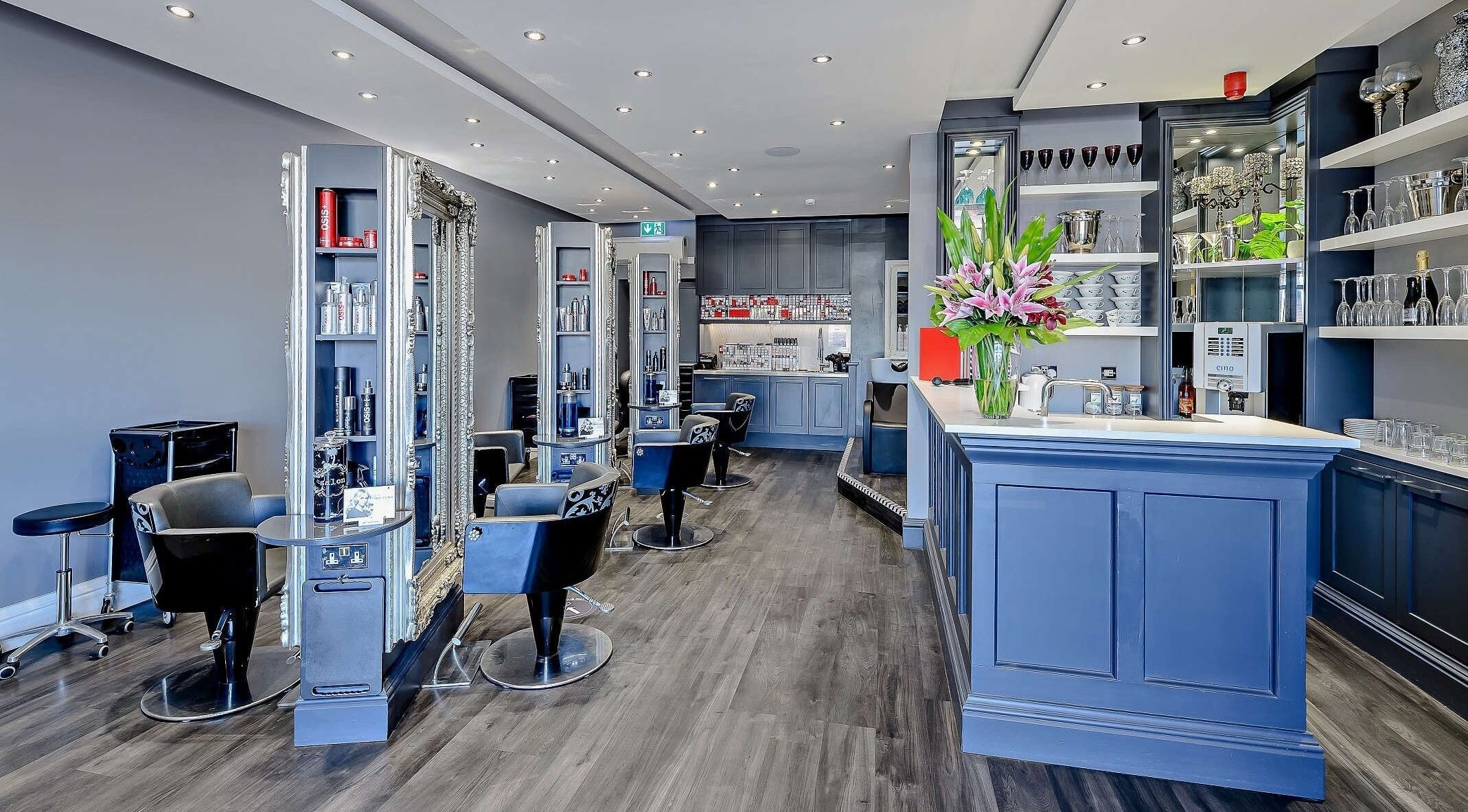 Luxury salon interior at Chewys Collective in Gloucester, England, GB, featuring modern decor and styling stations.