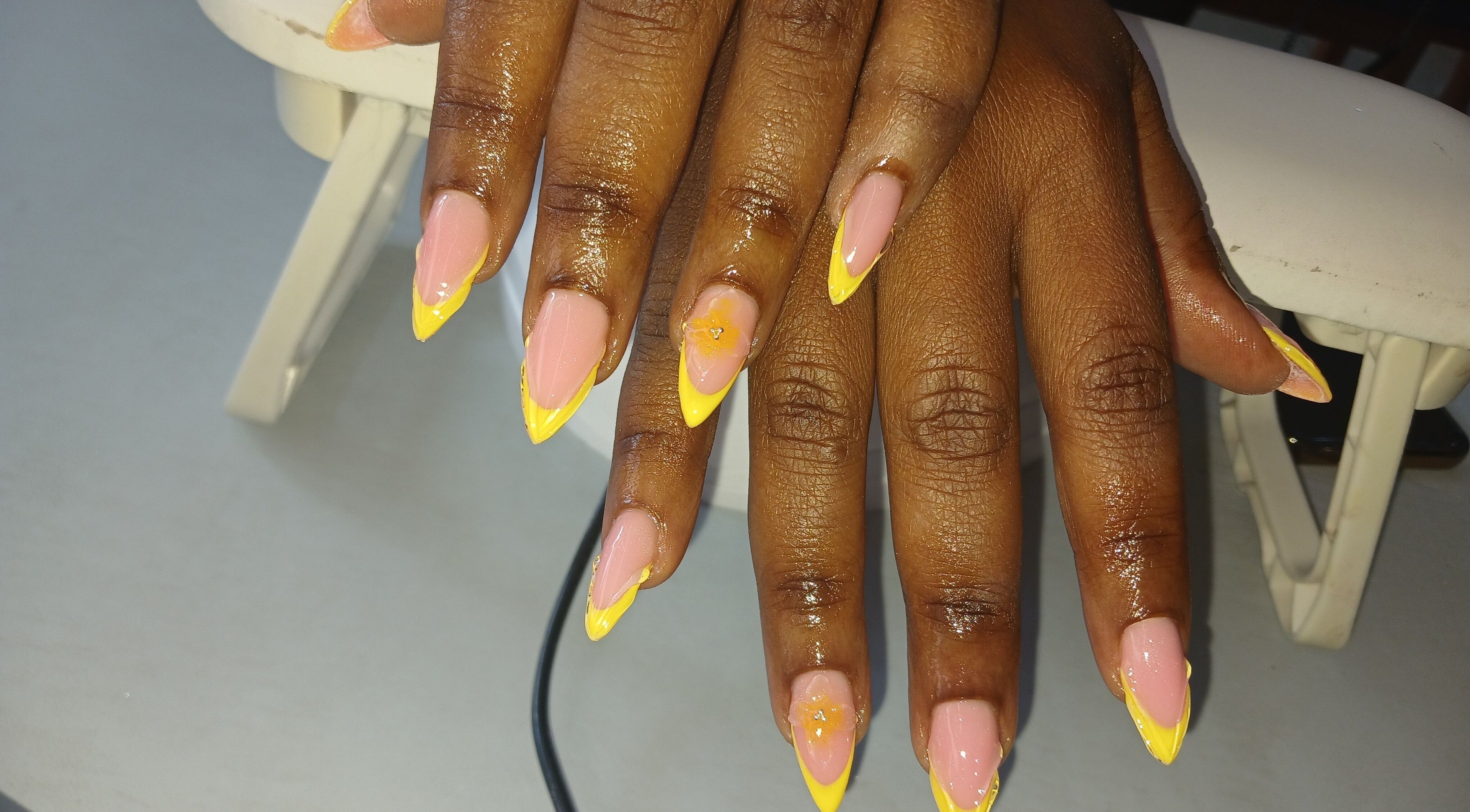 Stylish yellow-tipped nails at Pampered and Polished by Tk, Midrand, Gauteng, ZA.