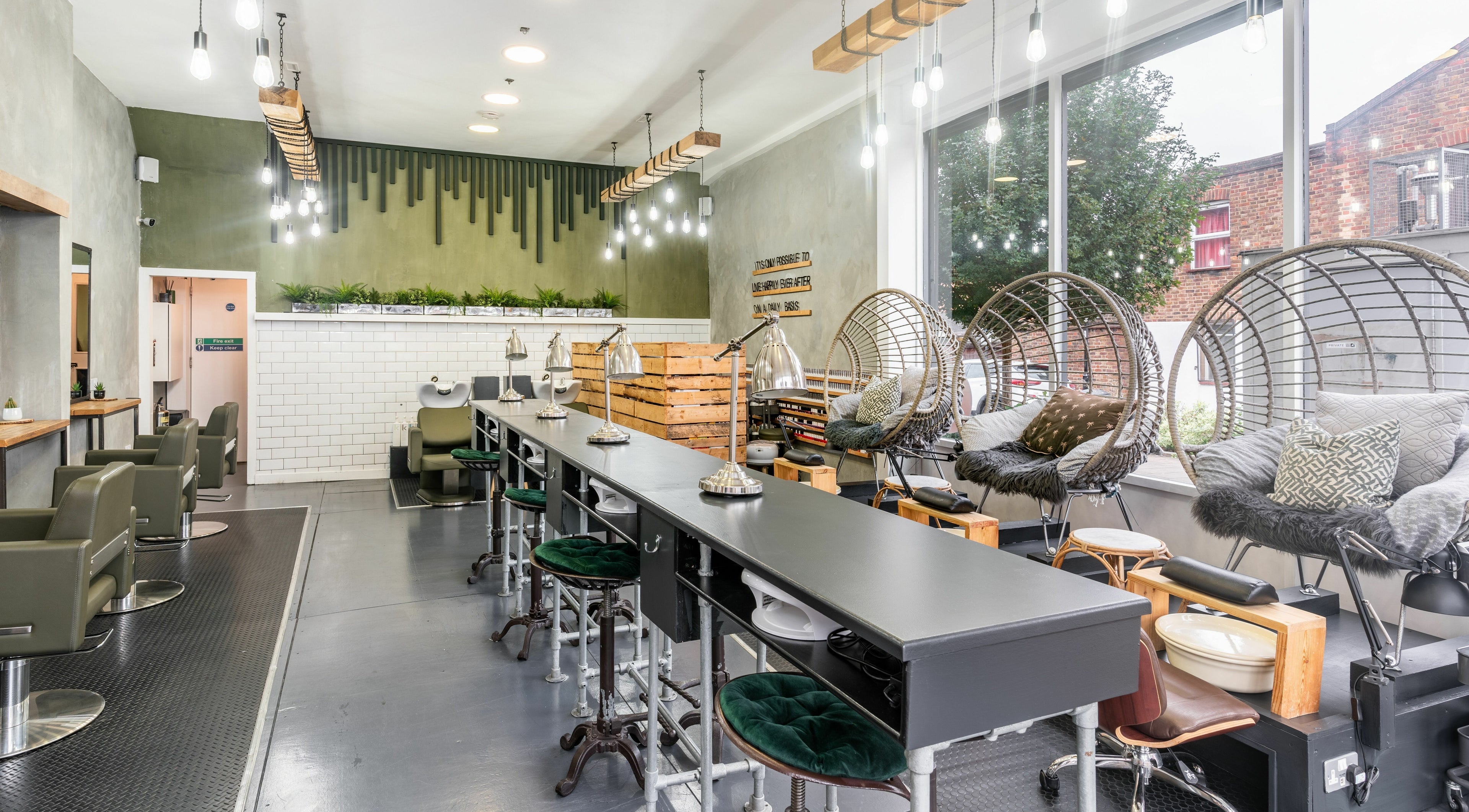 Chic interior of Pure Synergie, London, England, GB with modern salon setup and stylish seating.