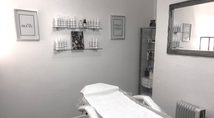 Relaxing treatment room at Enhanced Beauty and Well-Being, Swindon, England, GB with elegant decor.