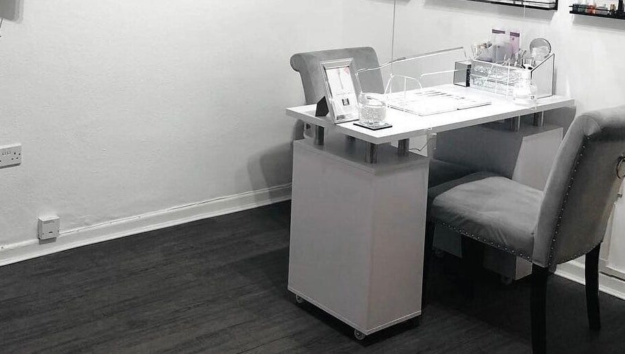 Professional nail station at Enhanced Beauty and Well-Being, Swindon, England, GB with elegant, cozy seating.