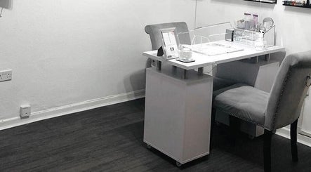 Professional nail station at Enhanced Beauty and Well-Being, Swindon, England, GB with elegant, cozy seating.