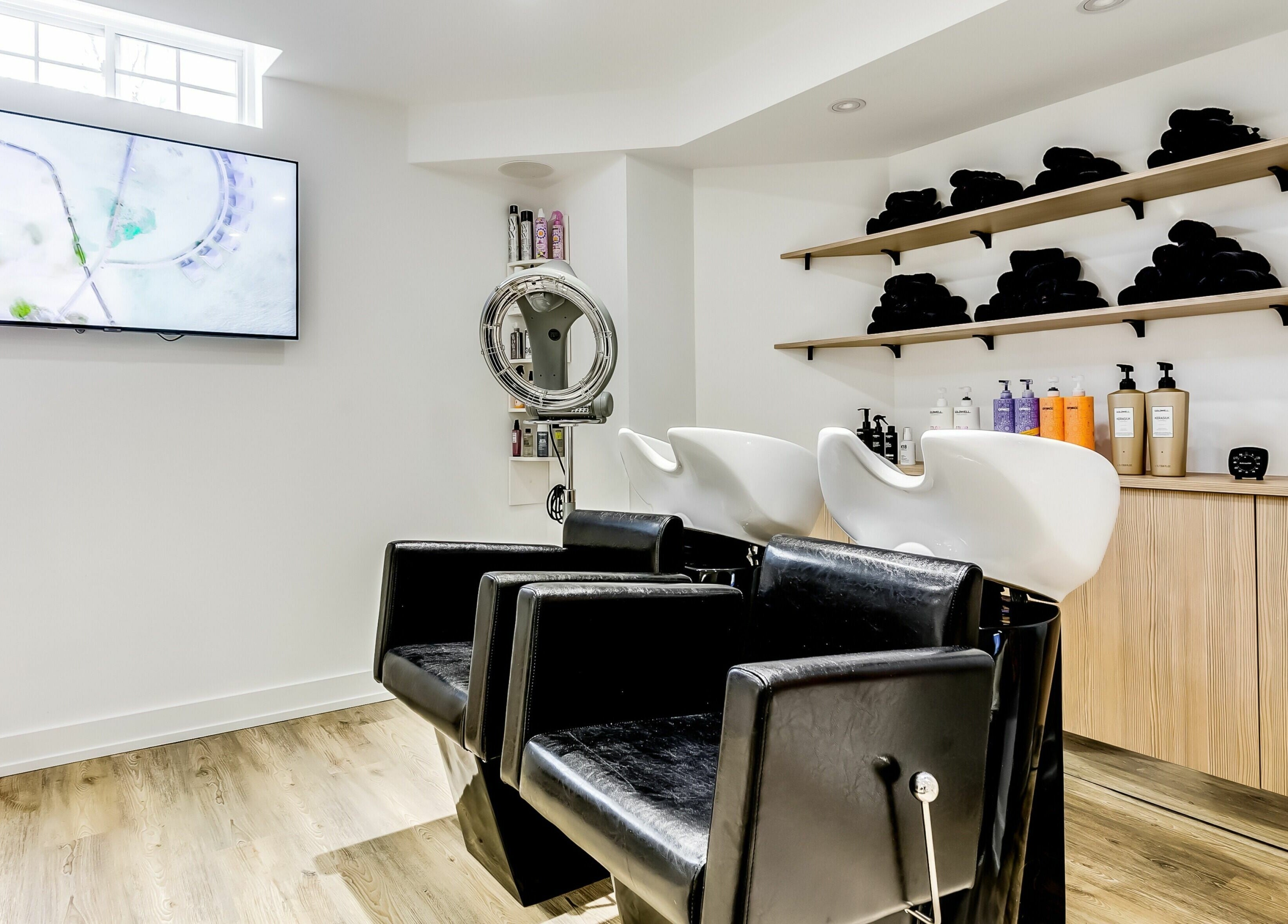 Stylish shampoo chairs and products at Slk Studio, Vaughan, Ontario, CA. Modern and relaxing ambiance.