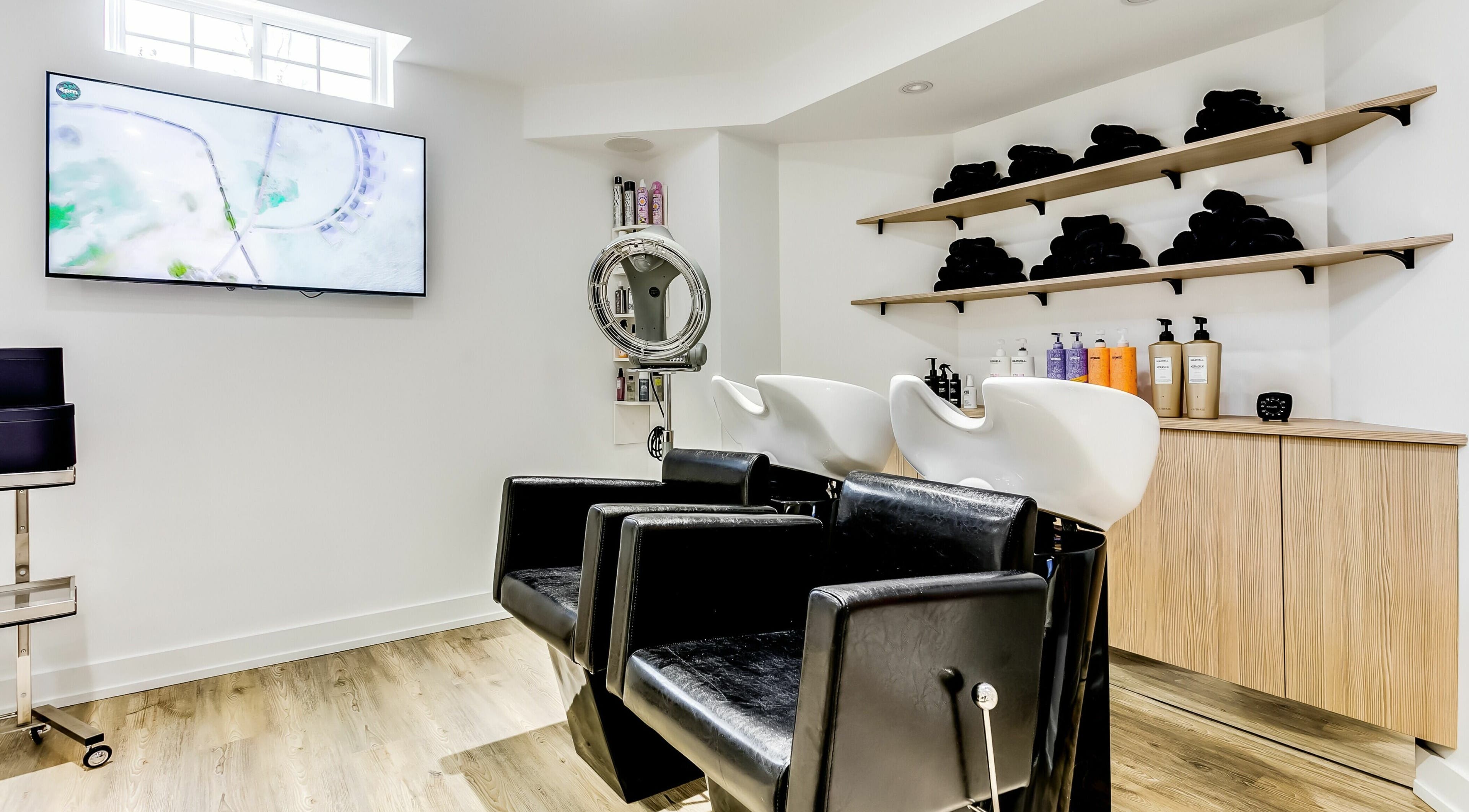 Stylish shampoo chairs and products at Slk Studio, Vaughan, Ontario, CA. Modern and relaxing ambiance.