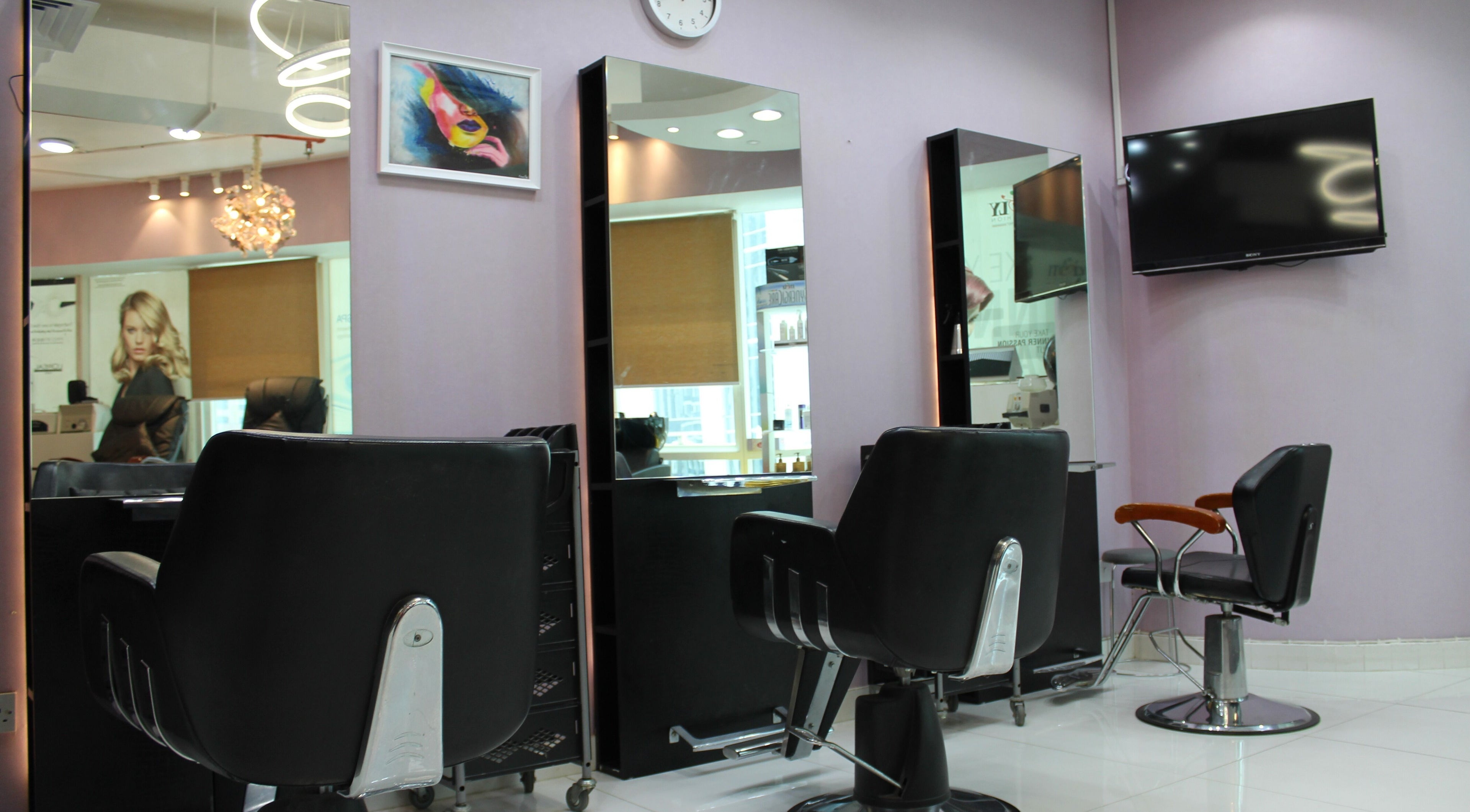 Modern salon interior at Beauty Beat DMCC, Dubai, Dubai, AE, featuring sleek chairs and mirrors.