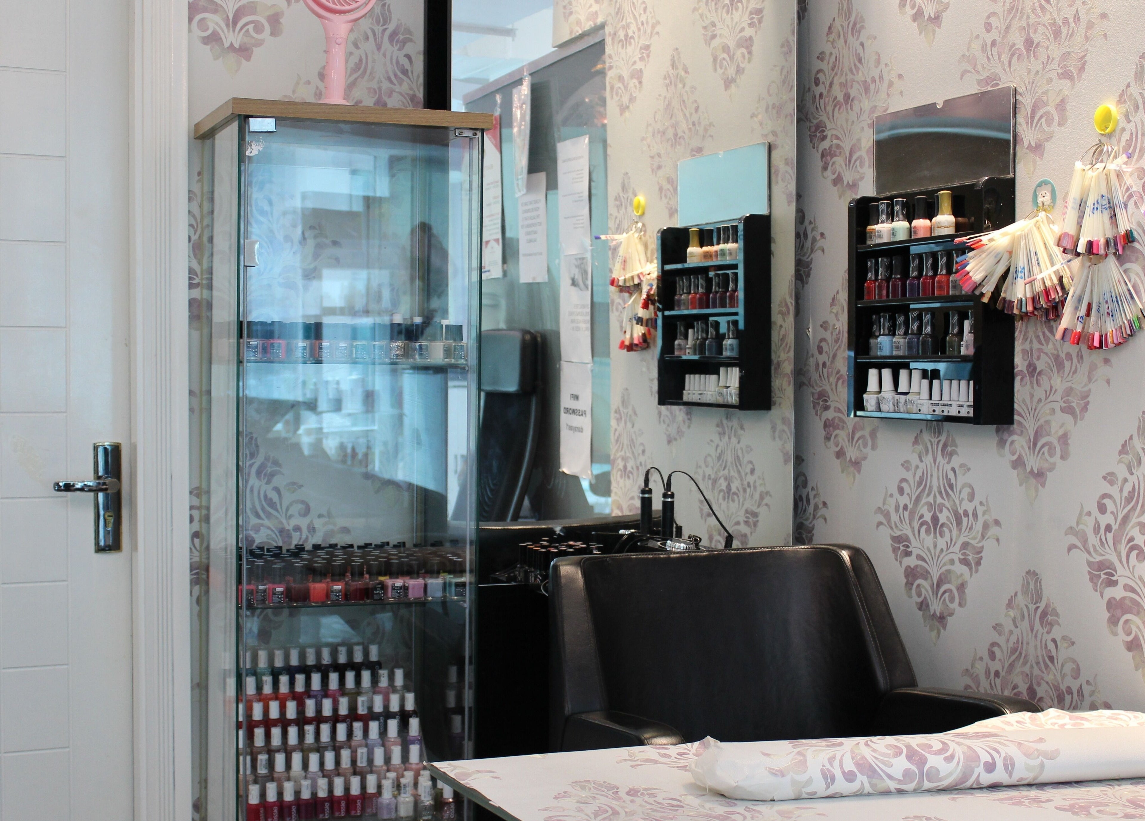 Chic nail polish display at Beauty Beat DMCC, Dubai, Dubai, AE, showcasing a stylish and serene setting for manicures.