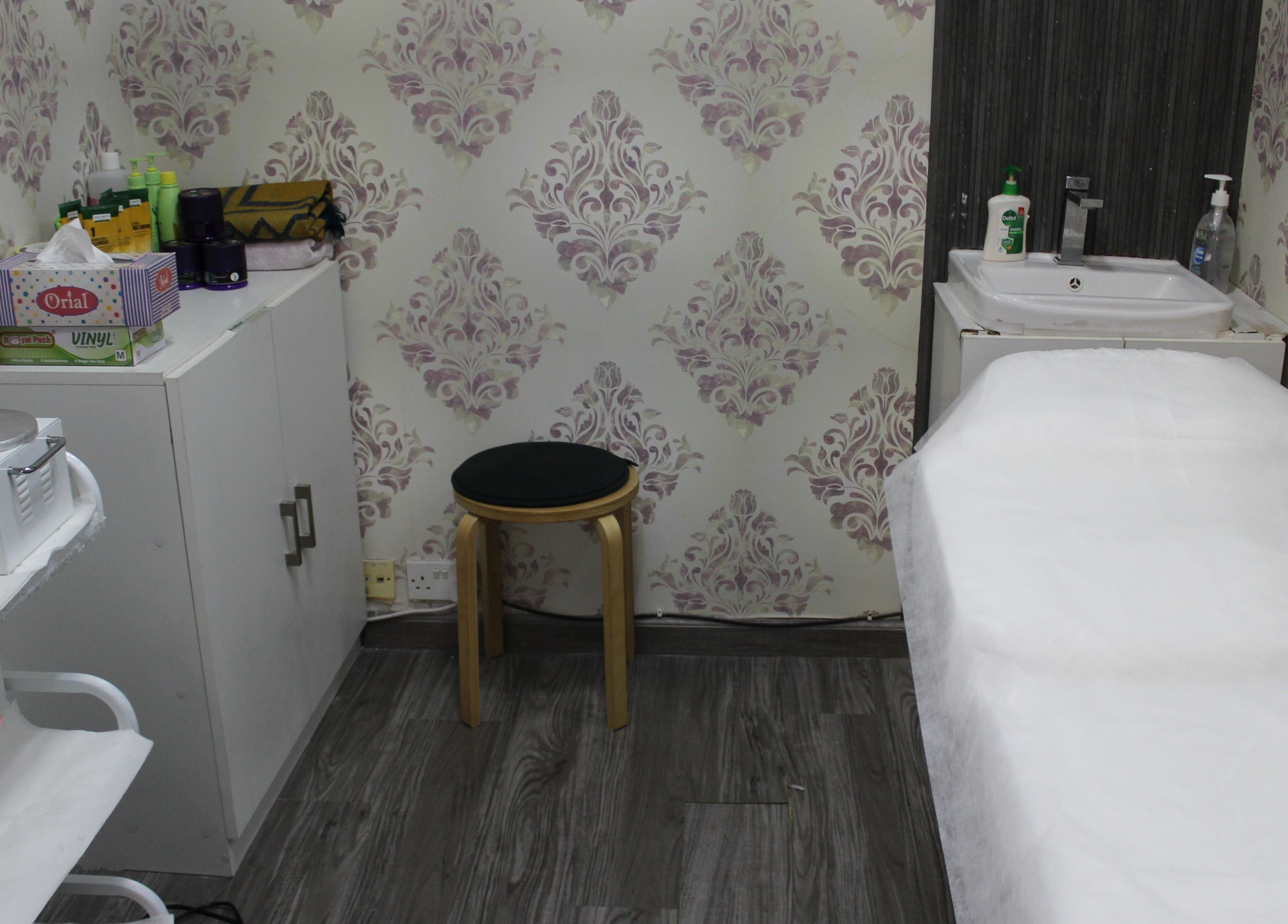 Cozy treatment room at Beauty Beat DMCC, Dubai, Dubai, AE with massage table and soothing decor.