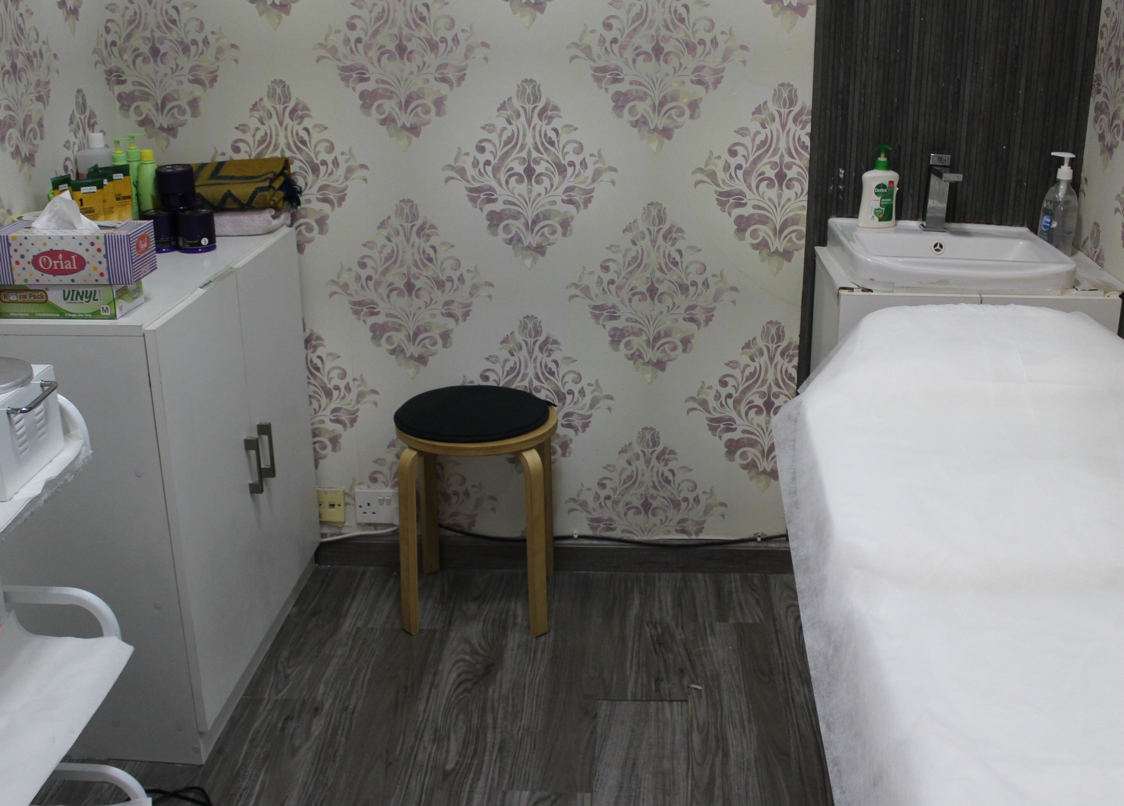 Cozy treatment room at Beauty Beat DMCC, Dubai, Dubai, AE with massage table and soothing decor.