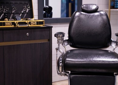 Vintage barber chair at Dudes Barbershop, Sheung Wan, Hong Kong Island, HK offering classic grooming.