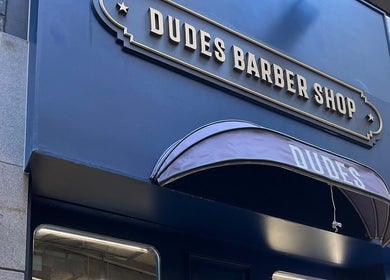 Entrance of Dudes Barbershop in Sheung Wan, Hong Kong Island, HK, featuring stylish signage.