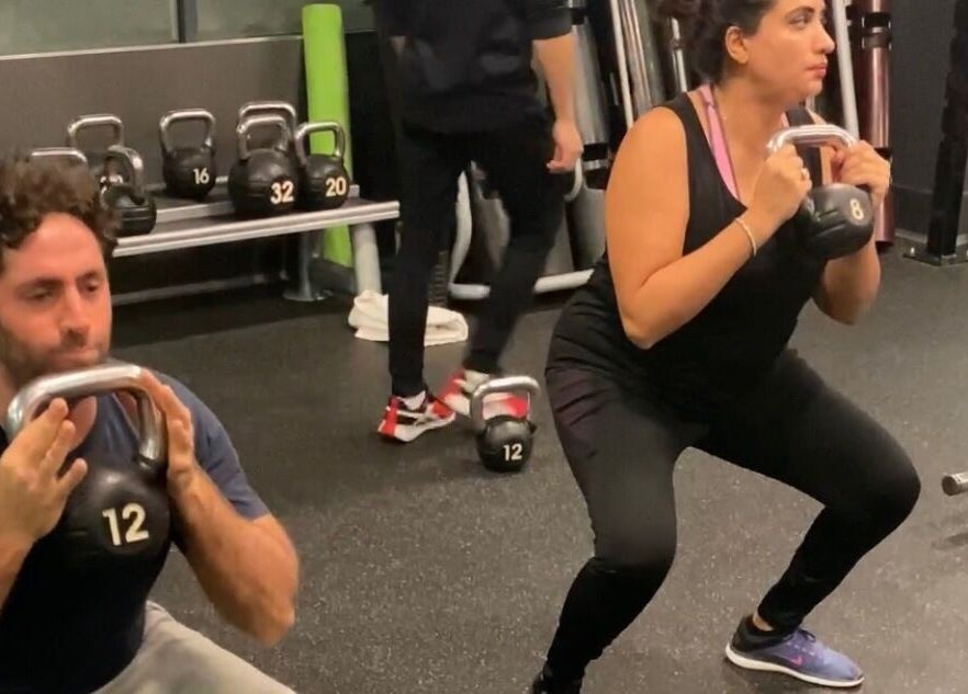 Clients doing kettlebell squats at JB FiTNESS PERSONAL TRAINING, London, England, GB.