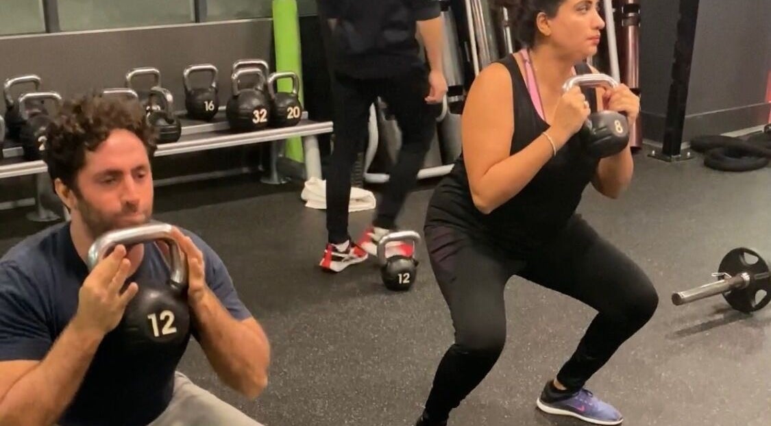 Clients doing kettlebell squats at JB FiTNESS PERSONAL TRAINING, London, England, GB.