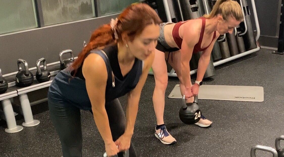 Women exercising with kettlebells at JB FiTNESS PERSONAL TRAINING, London, England, GB.