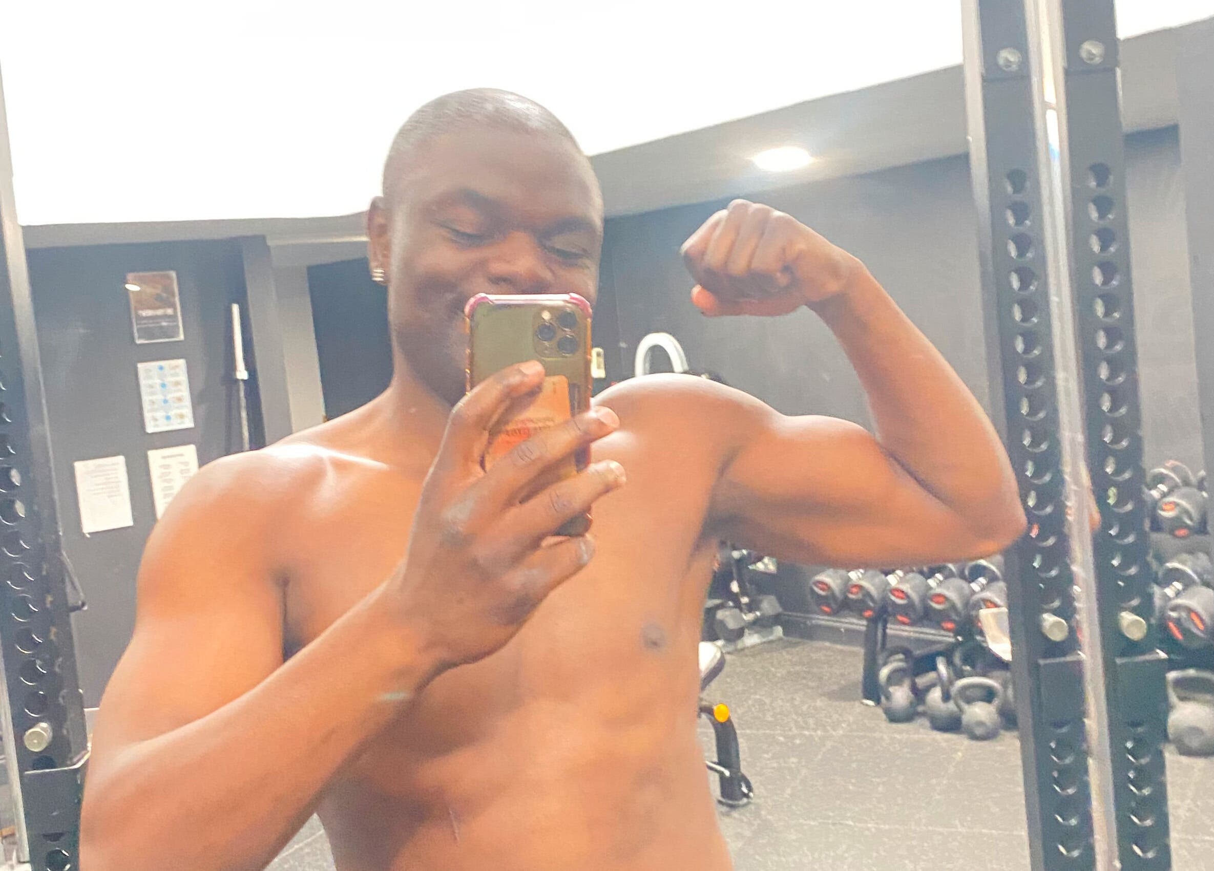 A person flexing in front of a mirror at JB FITNESS PERSONAL TRAINING, London, England, GB.