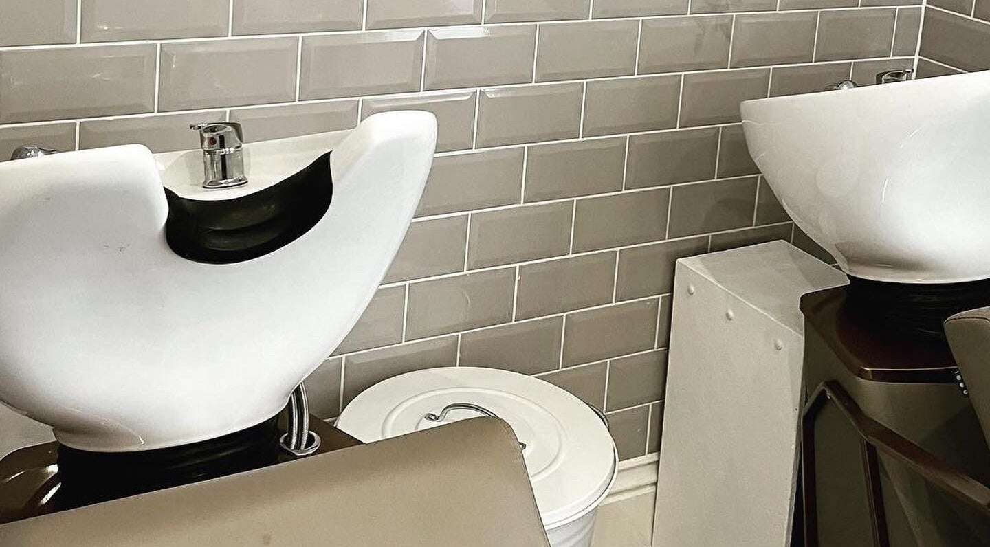 Modern shampoo stations at Hailgate Hair&Beauty in Howden, England, GB with sleek ceramic basins.