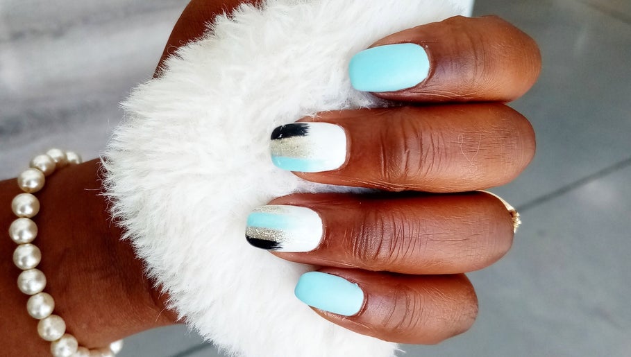 Elegant turquoise and white nail design at Jean's Hair Team in Gqeberha, Eastern Cape, ZA.