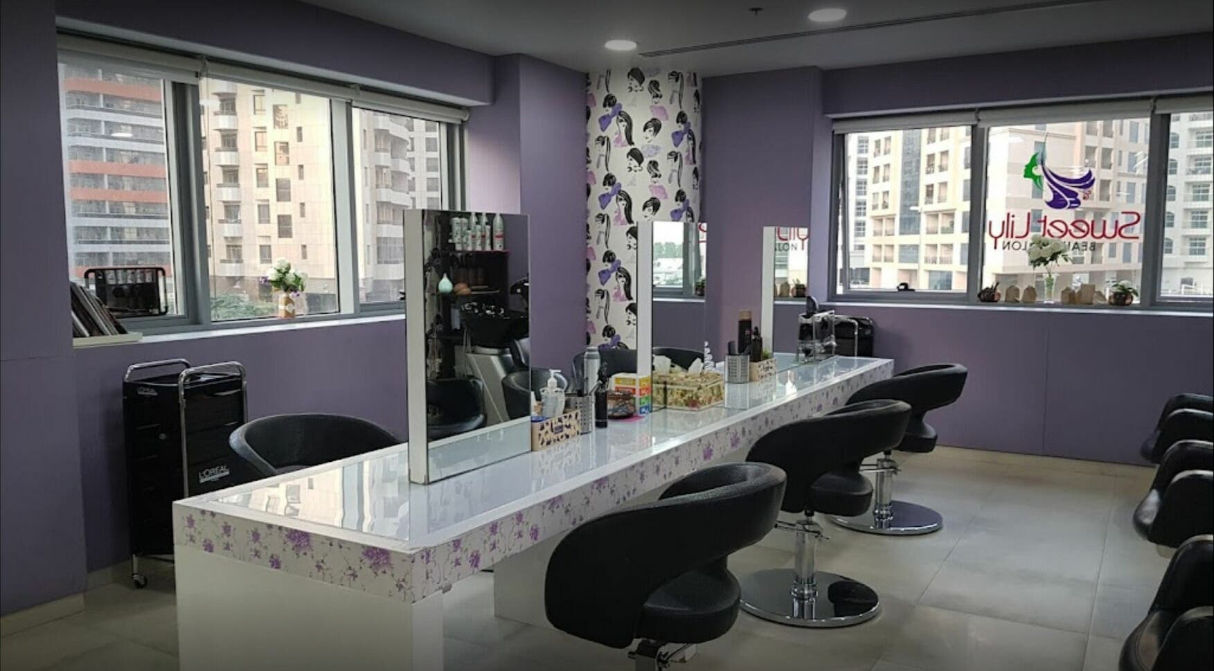 Interior of Sweet Lily Beauty Salon with stylish chairs and mirrors, located in Dubai, Dubai, AE.