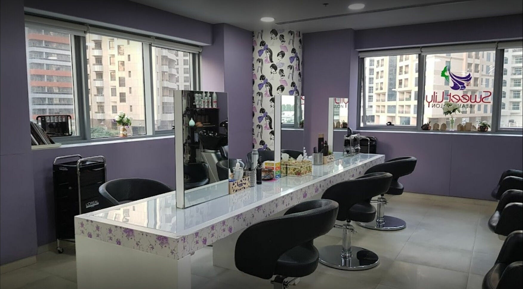 Interior of Sweet Lily Beauty Salon with stylish chairs and mirrors, located in Dubai, Dubai, AE.