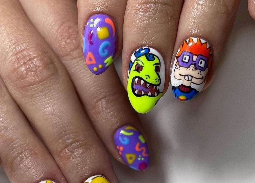 Colorful cartoon nail art at ZW Aesthetics, Howick, KwaZulu-Natal, ZA, featuring fun designs on manicured nails.