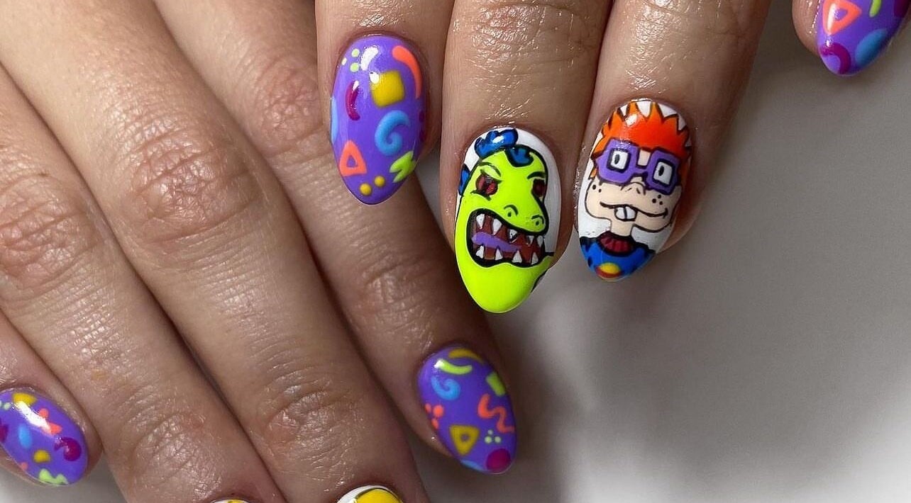 Colorful cartoon nail art at ZW Aesthetics, Howick, KwaZulu-Natal, ZA, featuring fun designs on manicured nails.