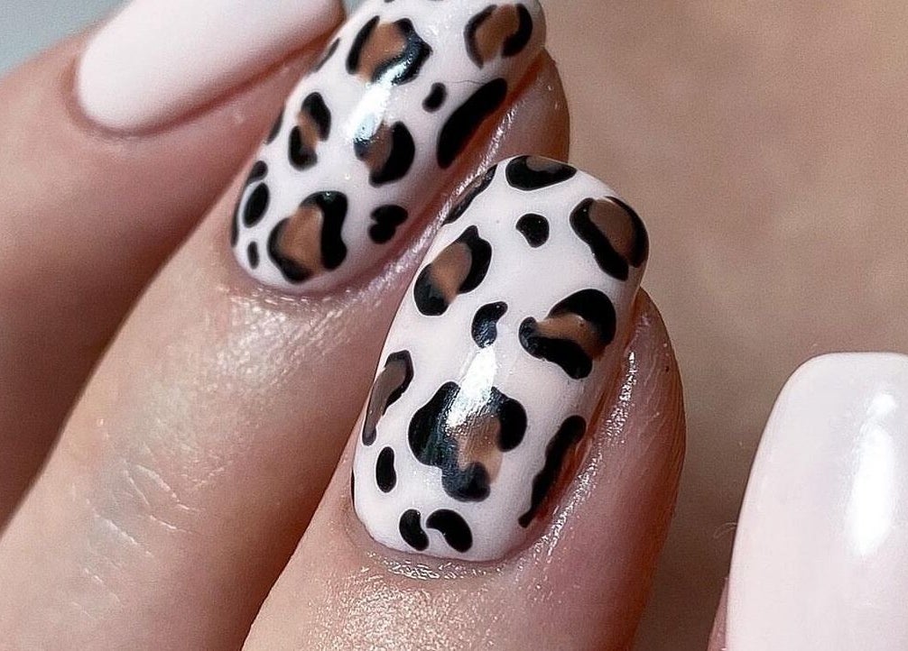 Leopard pattern nail art at ZW Aesthetics, Howick, KwaZulu-Natal, ZA. Stylish and creative manicure design.