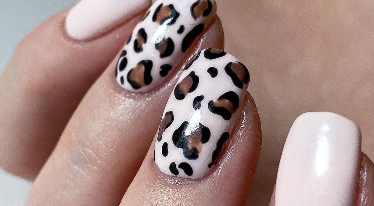 Leopard pattern nail art at ZW Aesthetics, Howick, KwaZulu-Natal, ZA. Stylish and creative manicure design.