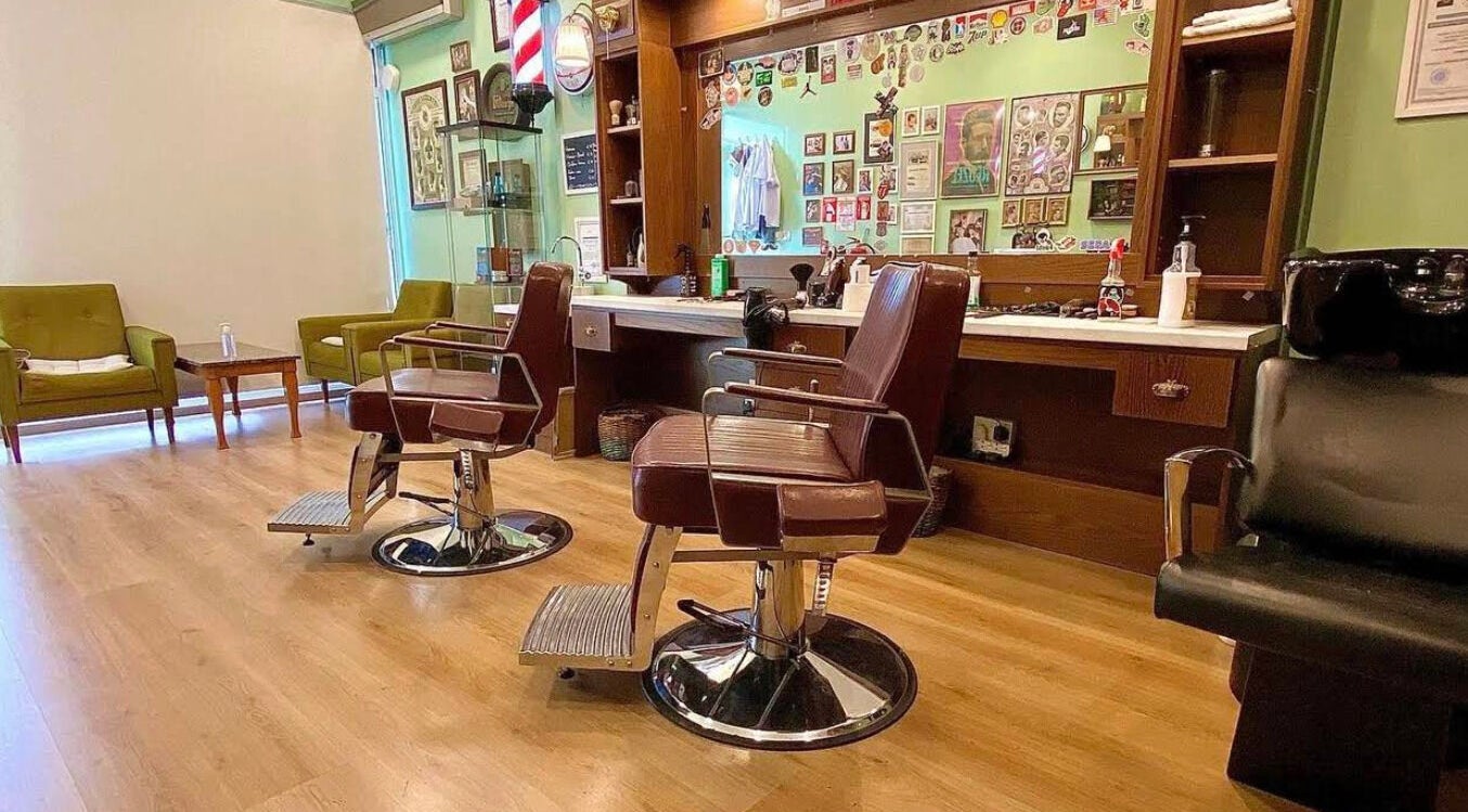 Elegant barber chairs at Antonio Barbero in Mesa Geitonia, Limassol, CY, showcasing a stylish interior.