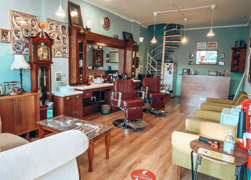 Vintage interior of Antonio Barbero in Mesa Geitonia, Limassol, CY, featuring classic barber chairs.