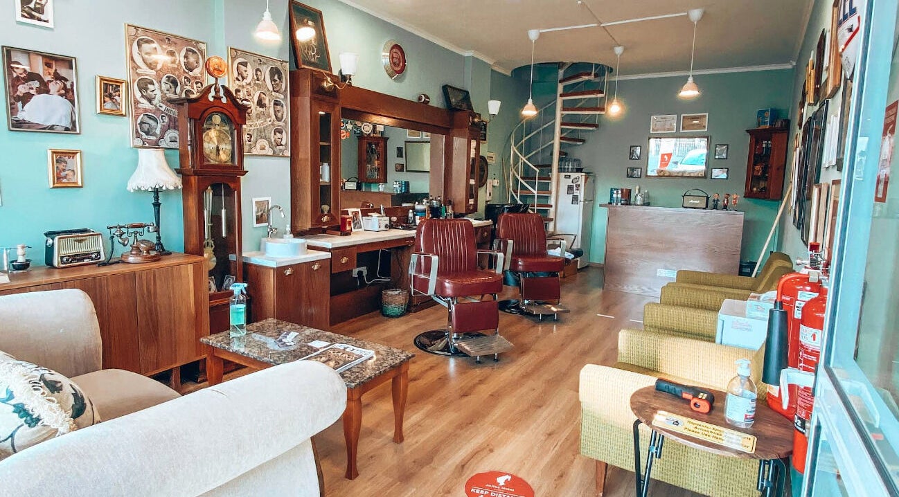 Vintage interior of Antonio Barbero in Mesa Geitonia, Limassol, CY, featuring classic barber chairs.