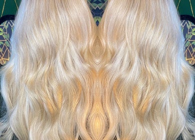Elegant blonde waves styled at Moon Hair, East Ardsley, England, GB, showcasing luxurious hair texture.