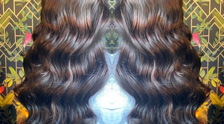 Voluminous wavy hair styled at Moon Hair, East Ardsley, England, GB, showcasing rich, glossy texture.