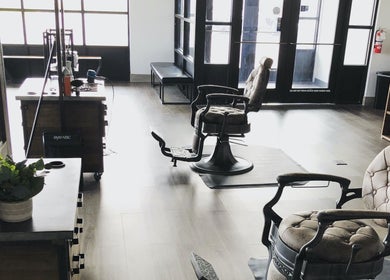 Cozy interior of Angie’s Barbershop in Billings, Montana, US with vintage styling chairs and modern decor.