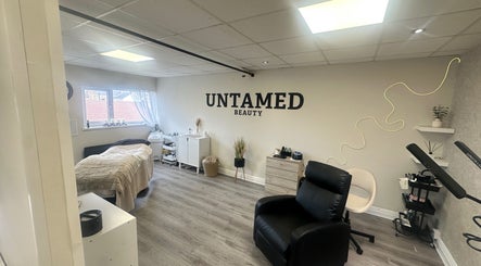 Untamed Beauty by Kelly in Consett, England, GB showcases a calming spa room with elegant decor and treatment area.