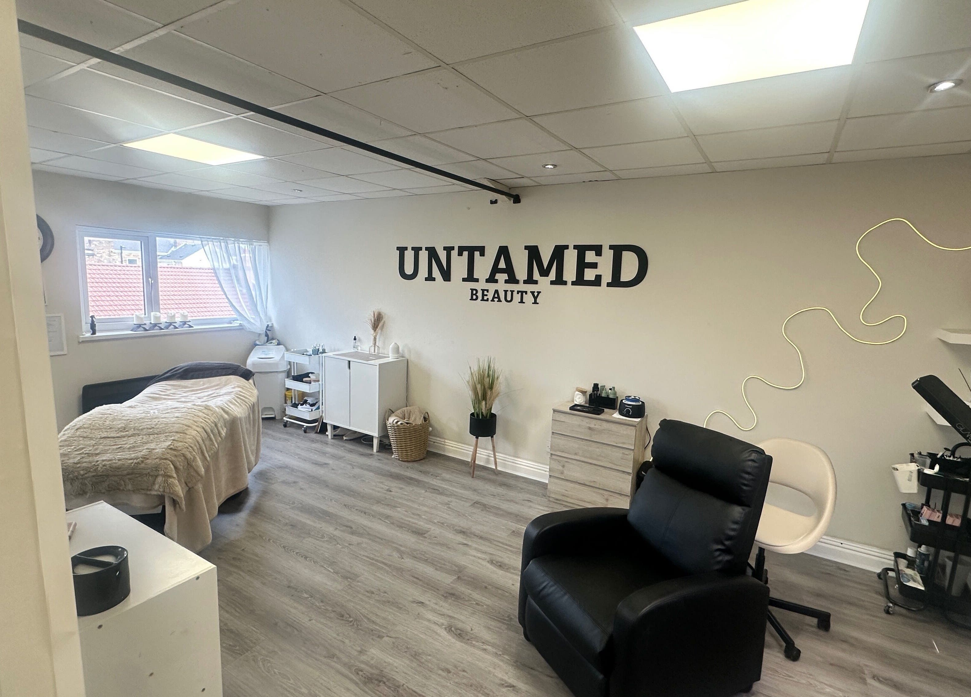 Serene treatment room at Untamed Beauty by Kelly in Consett, England, GB with soothing decor.