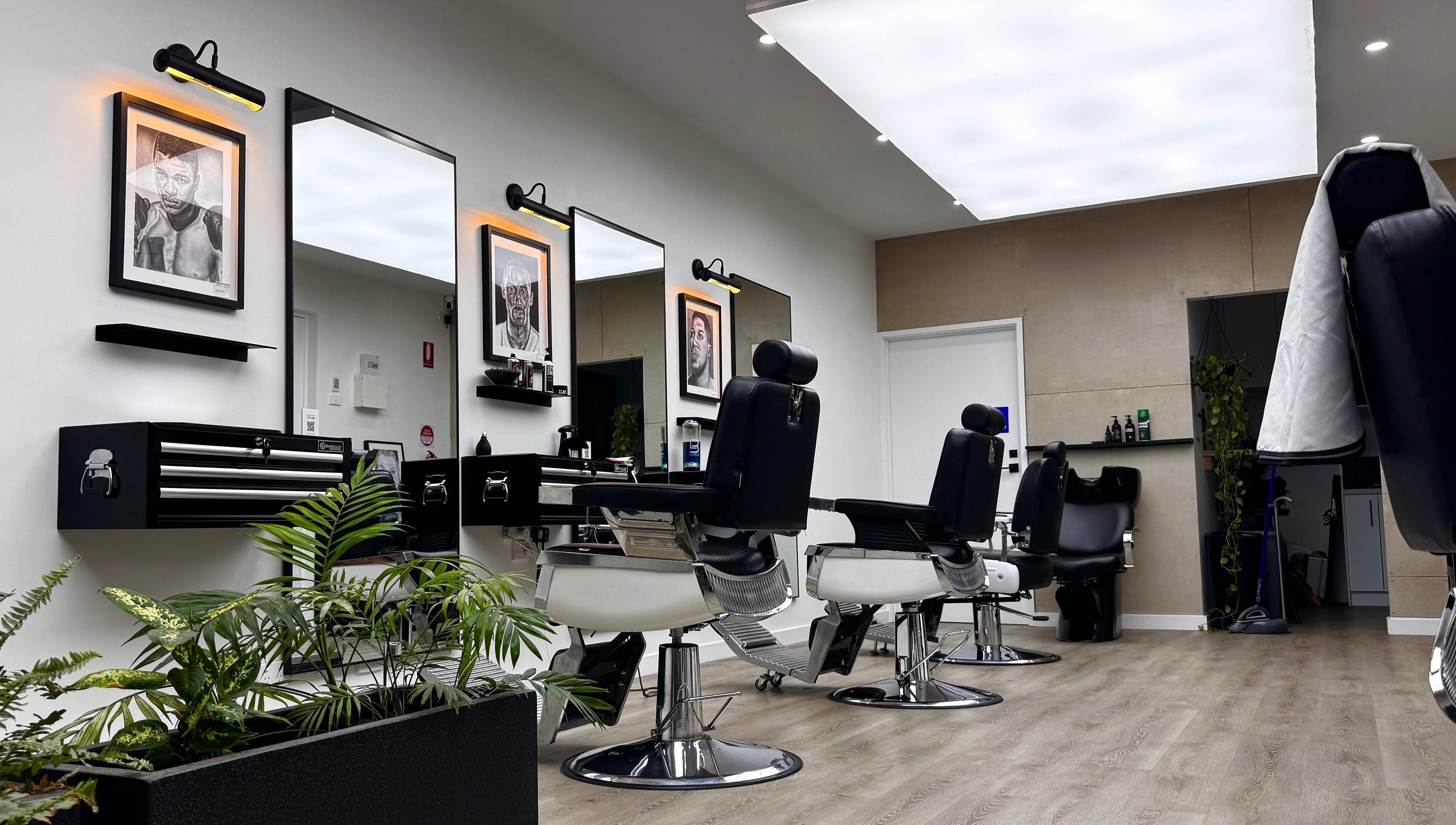 Modern barber chairs at The Art Barbers Malvern, Melbourne, Victoria, AU in sleek, stylish setting.