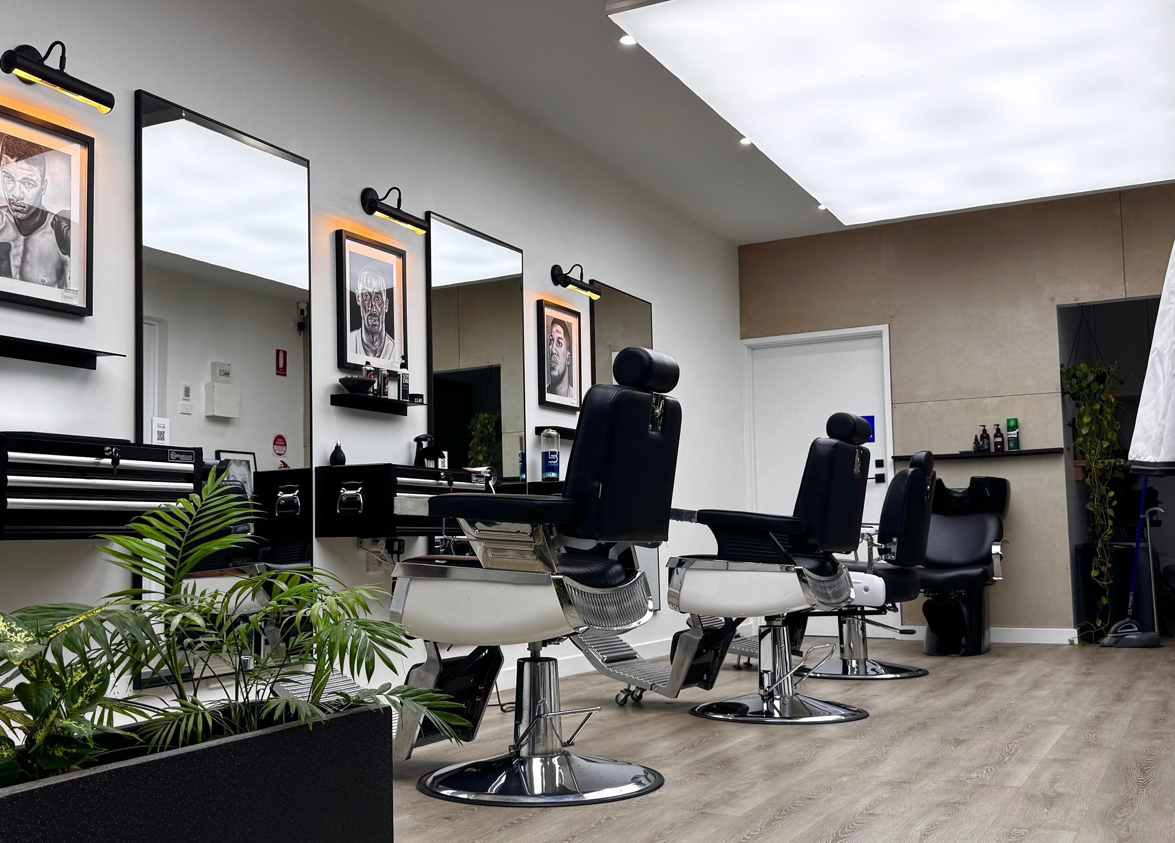 Modern barber chairs at The Art Barbers Malvern, Melbourne, Victoria, AU in sleek, stylish setting.