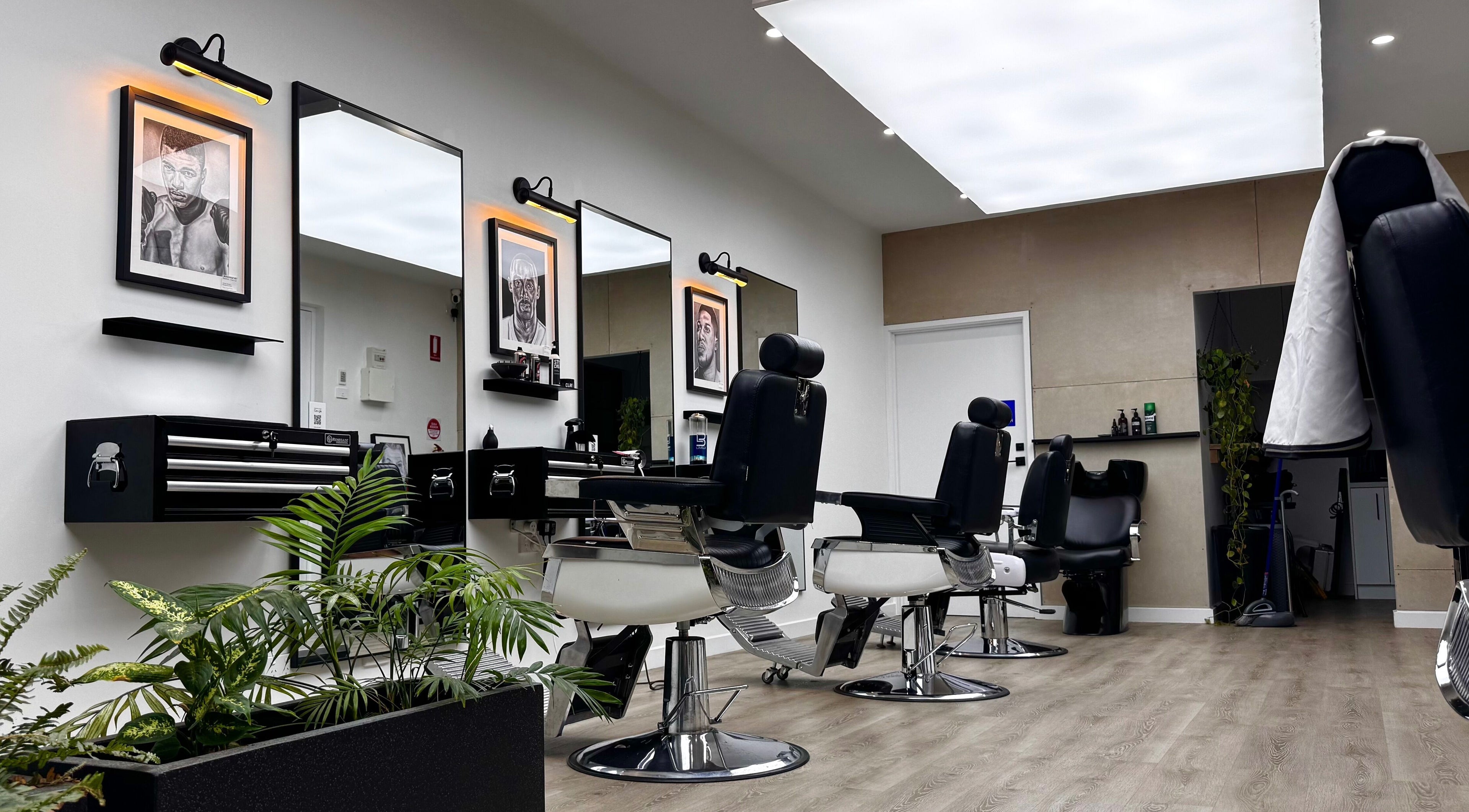 Modern barber chairs at The Art Barbers Malvern, Melbourne, Victoria, AU in sleek, stylish setting.