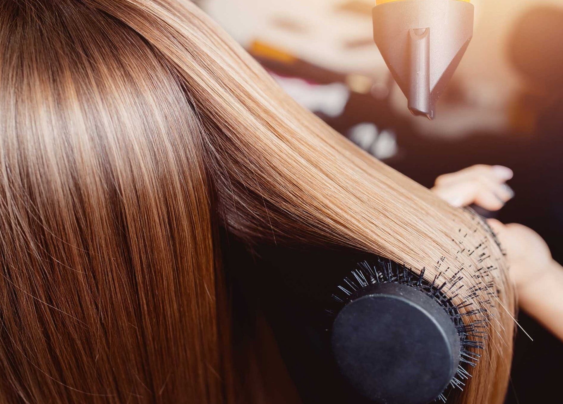 Professional hair blow-drying at Bare Skin Aesthetics, Banff, Scotland, GB for sleek, shiny results.