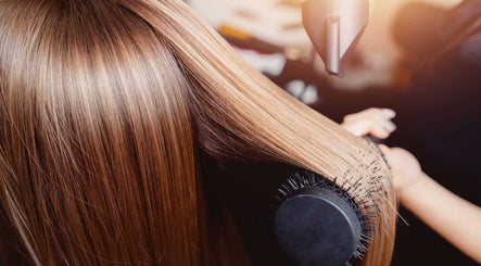 Professional hair blow-drying at Bare Skin Aesthetics, Banff, Scotland, GB for sleek, shiny results.