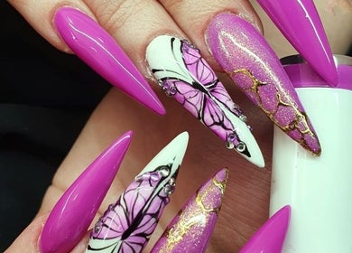 Stunning butterfly nail art at The Look Hair, Nails & Beauty Salon in Zabbar, MT, featuring pink and gold designs.